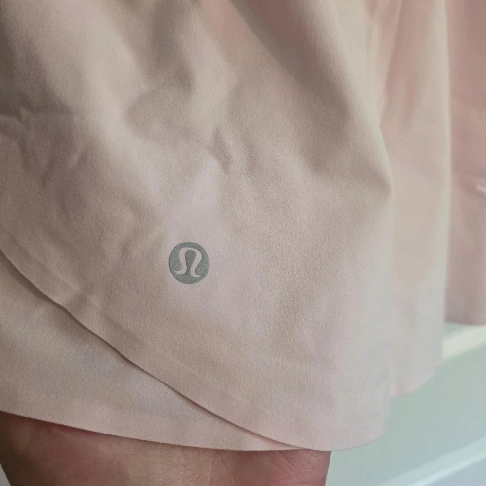 Lululemon Shake It Out High Rise Run Shorts in light baby pink pearl color